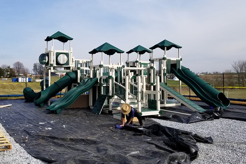 A commercial playset being installed.